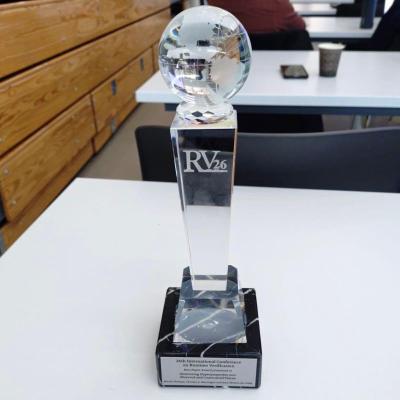 Crystal trophy featuring the RV 2026 logo, awarded for Best Paper at the 26th International Conference on Runtime Verification.
