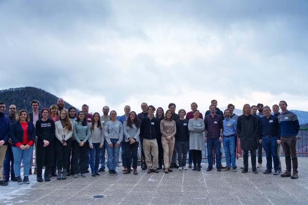 Group photo of SPyCoDe Retreat participants standing on the terrace